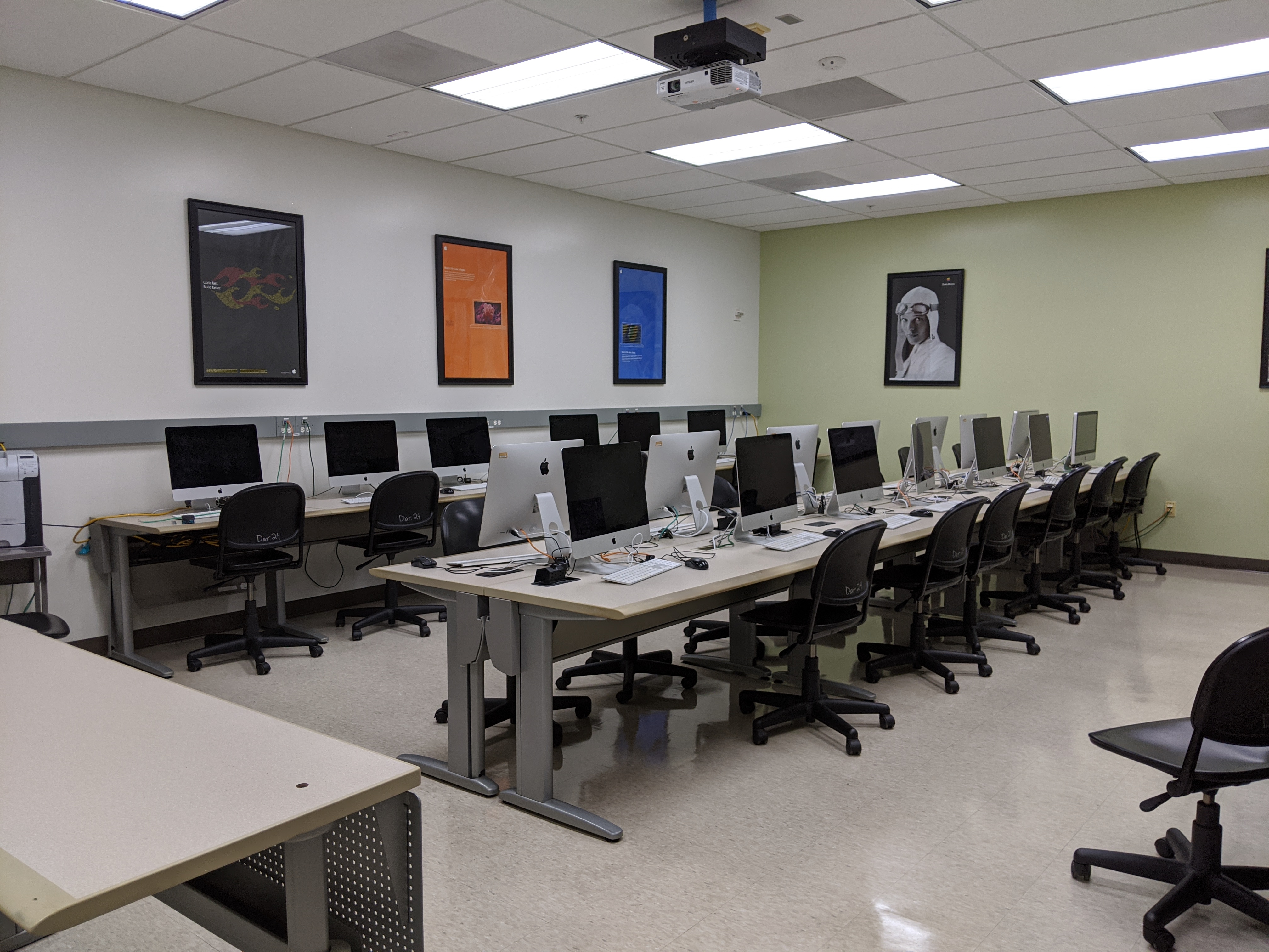 Empty computer lab with rows of computers