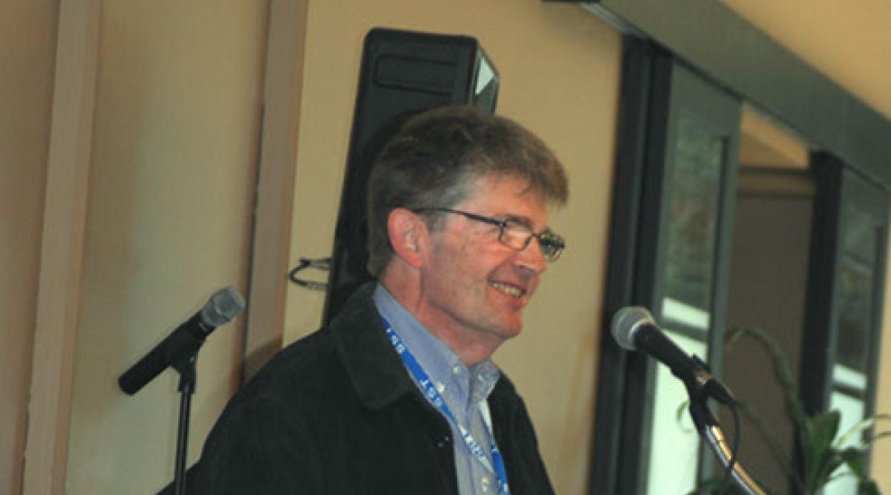 George Ledin speaking at a podium
