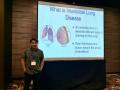 Student in front of a presentation screen titled "What is Interstitial Lung Disease?"