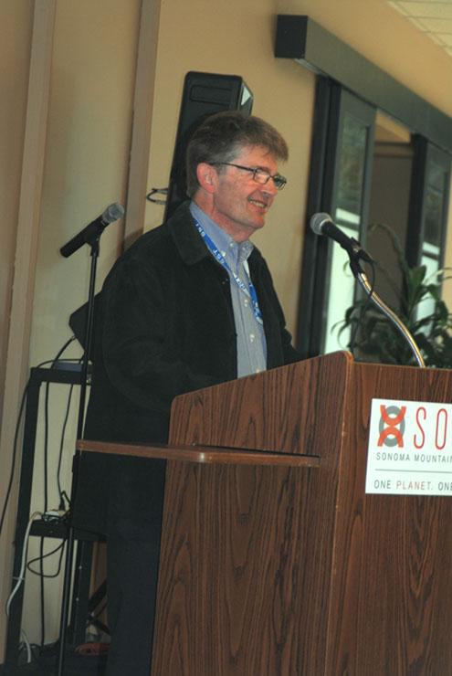 George Ledin speaking at a podium